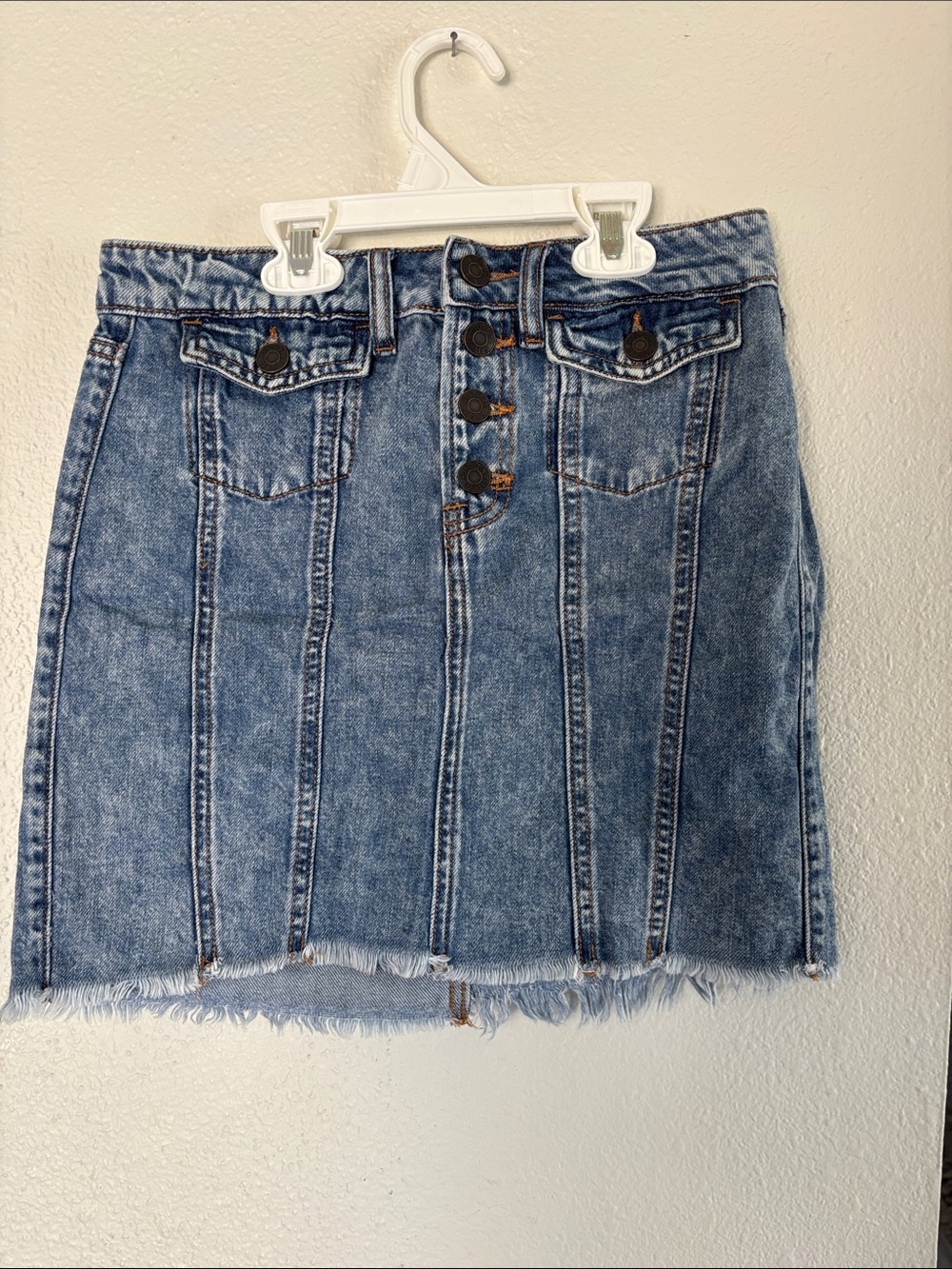 High-Rise Washed Blue Denim Mini Skirt with Button Front